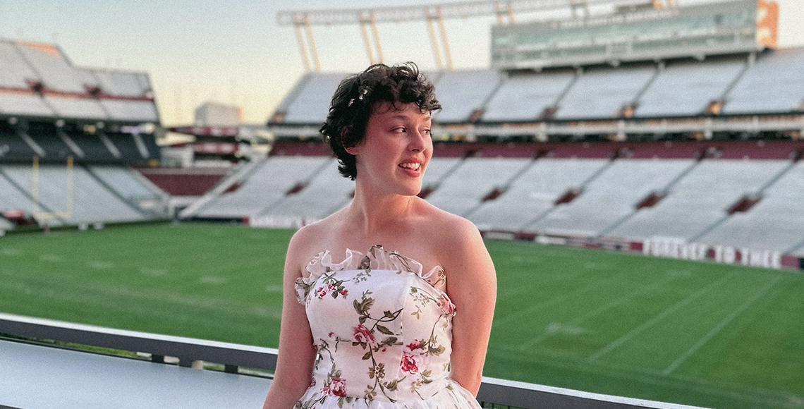 Rachael Davis in a floral-patterned dress at Honors Gala.