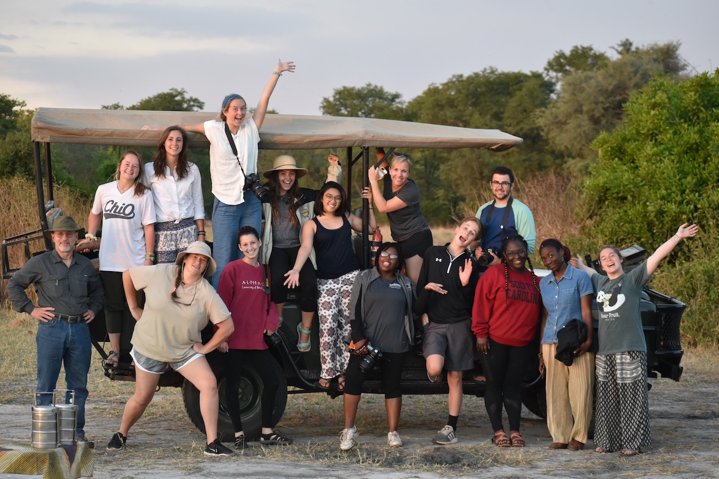 Students from a previous Malawi study abroad course celebrate a successful safari. 