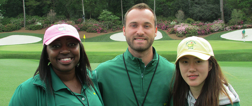 Three students pose at the Masters