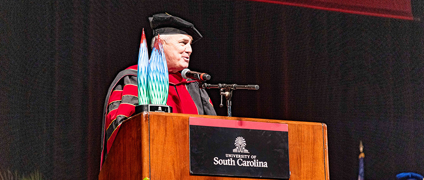 Tim Leiweke addresses graduates at the University of South Carolina’s Degrees of Excellence event after being honored with an award named in his honor.