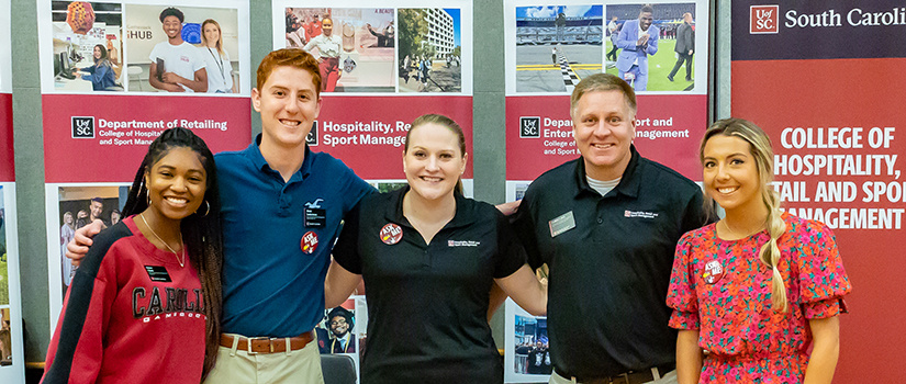 Collin Crick and Laura Nix pose for a photo with three members of the HRSM Leaders Program.