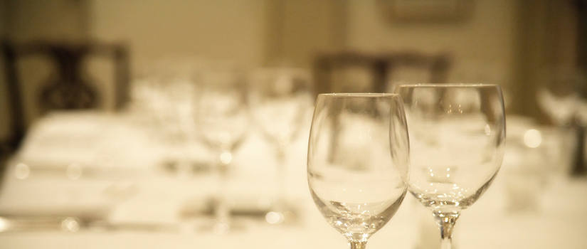 Generic image close up of water and wine glasses on a table.