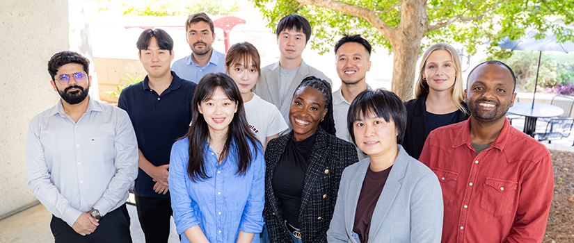 Sport and entertainment Ph.D. students pose for a group photo