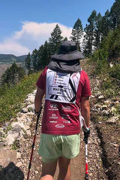 Zach Watson hikes up a mountain