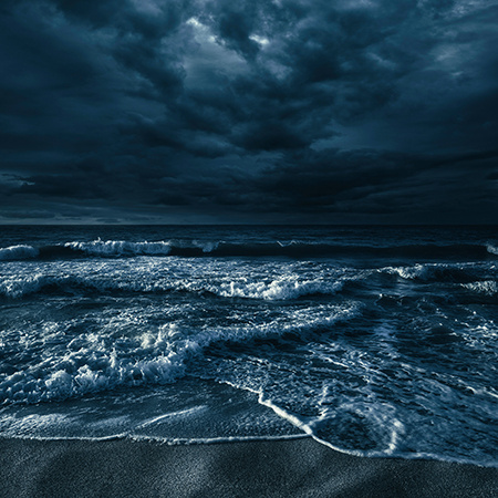 A dark, stormy beach scene