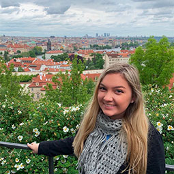 Jessica Rhinesmith traveled to the Czech Republic this summer. Here she poses on an overlook of a beautiful city.