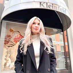 Madalyn Hair stands in front of the entry to Kleinfeld Bridal in New York City