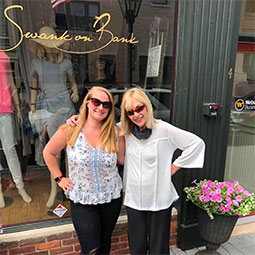 Jaclyn Newbert stands in front of her new store, Swank on the Bank