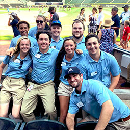 Sport and Entertainment students gather while working at a large sporting event.
