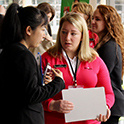 A recruiter meets with a student during the HRSM Experience Expo
