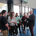 A group of Sport and Entertainment Management graduate students get a tour of a large sport and entertainment venue.