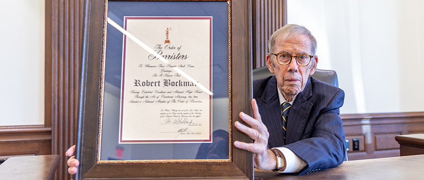 Bob Bockman holding award