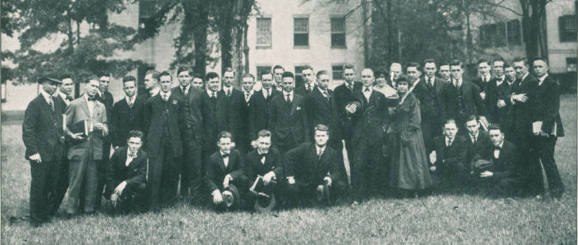 Historic photo of the Law Class of 1918, all white males except for two white female students..