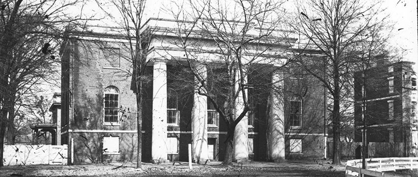 Black and white historic photo of the Caroliniana Library, where the first ever law class was held.
