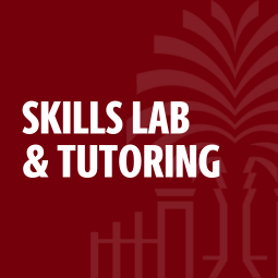 overhead shot looking down at students studying in the law school reading room.