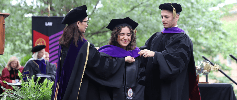 Commencement student getting hooded