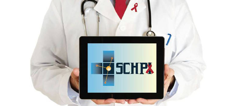 Doctor in white coat holding computer tablet with SCHPI on the screen.