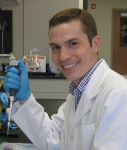 Joe McQuail in white lab coat