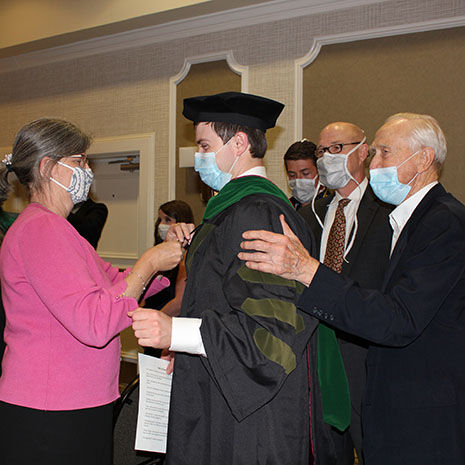 Student being hooded