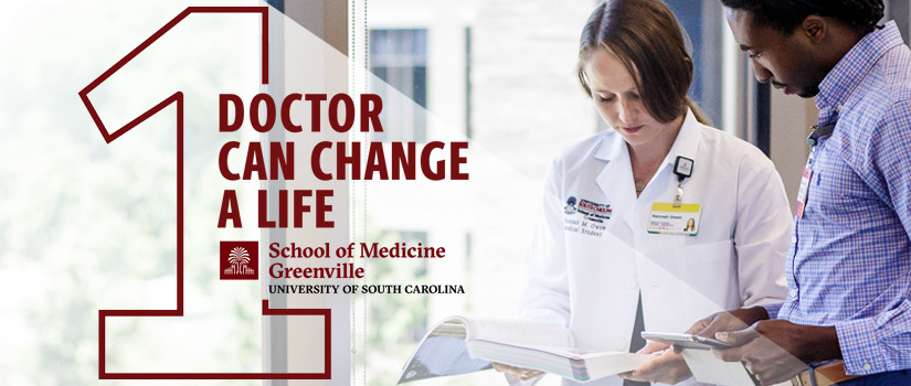 Two med students review a chart in front of a window. One doctor can change a life logo.