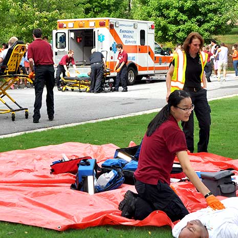 EMTs treating the injured during disaster drill.