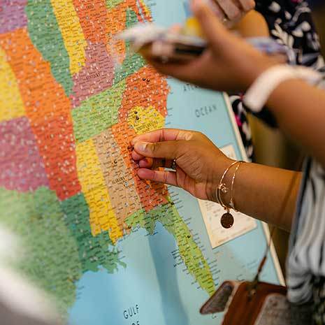 Students pin their residency locations on a map at Match Day.