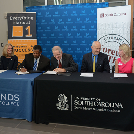 Moore School and Midlands Technical College administrators sign the operations and supply chain transfer pathway agreement at a Sept. 9 press conference