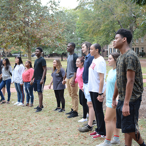 Group of Rising Scholars participating in an exercise on the Horseshoe