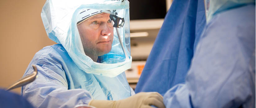 Banner Image of James Loging in an operating room