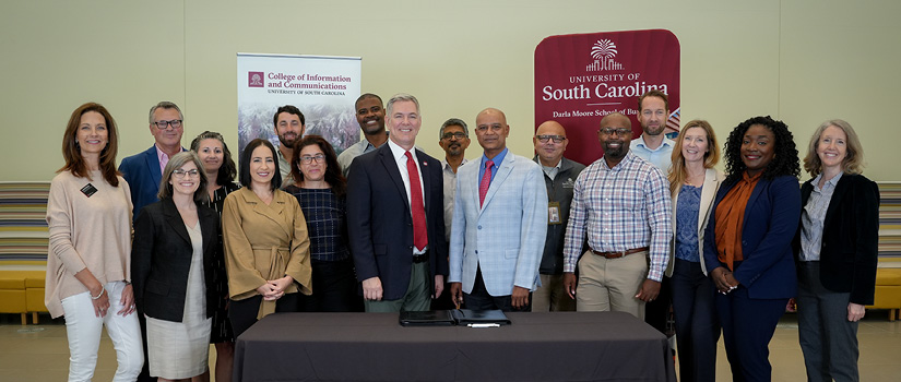 Image of the Moore School and College of Information and Communications staff for the master's partnership signing