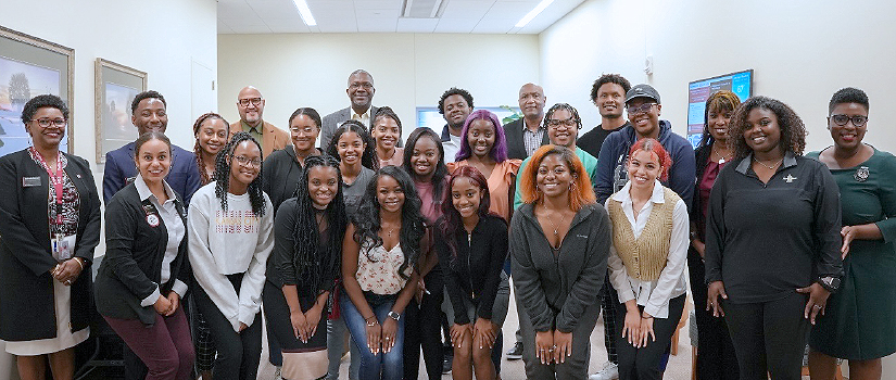 group photo of black alumni alliance and students
