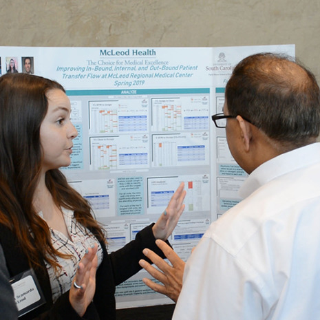 A student presents her McLeod Health project at the Industry Summit