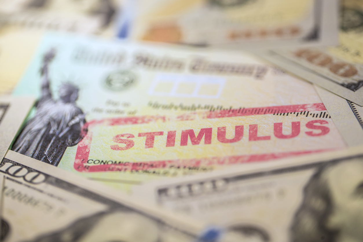 image of money, various bills with "stimulus" stamped on top