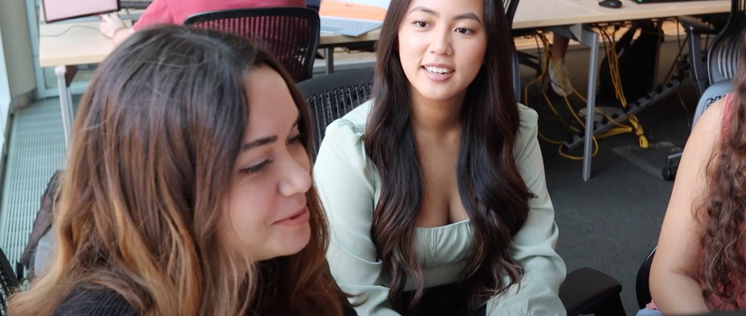 three female students talking; click to play MIB video