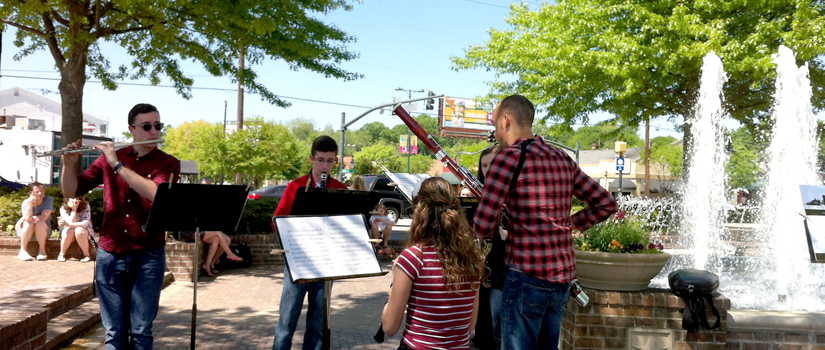 Musicians play in the rose garden during Sounds Around Town event.