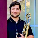 Cameron Unger holding a trombone