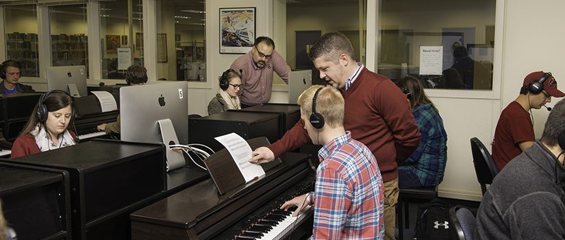 Dr. Jenkins with theory students in piano lab