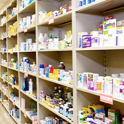 shelves with medication packages and bottles