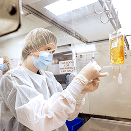 Pharmacist in sterile protective gear