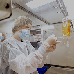 Student in sterile compounding lab