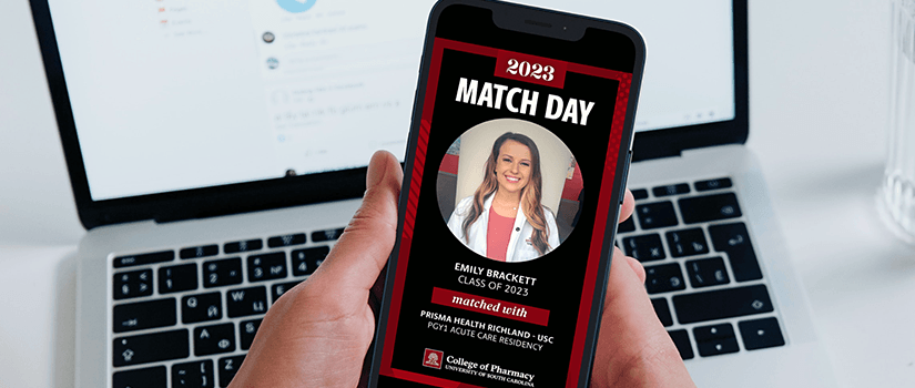 Hands holding phone with Match Day graphic