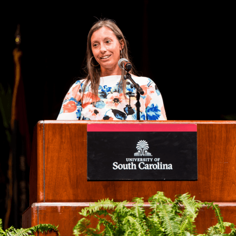 Woman standing at podium