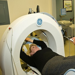Woman in cancer screening machine