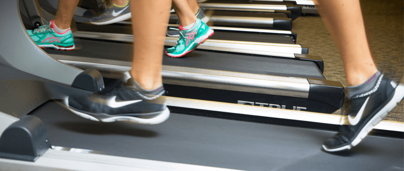 Close up of feet running on a treadmill