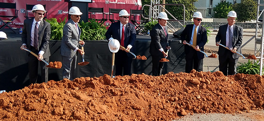 University leadership take part in the groundbreaking ceremony for the Campus Village housing project.