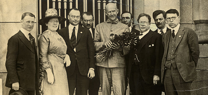 Eugene Debs, at center with flowers, who was serving a prison sentence for violating the Espionage Act, on the day he was notified of his nomination for the presidency on the socialist ticket by a delegation of leading socialist