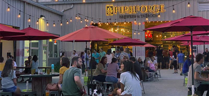 Patrons enjoy outdoor seating at Fireforge taproom.