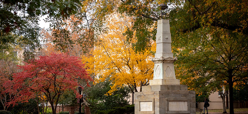 Trees with leaves in fall colors on the Horseshoe with Maxcy Monument in the foreground