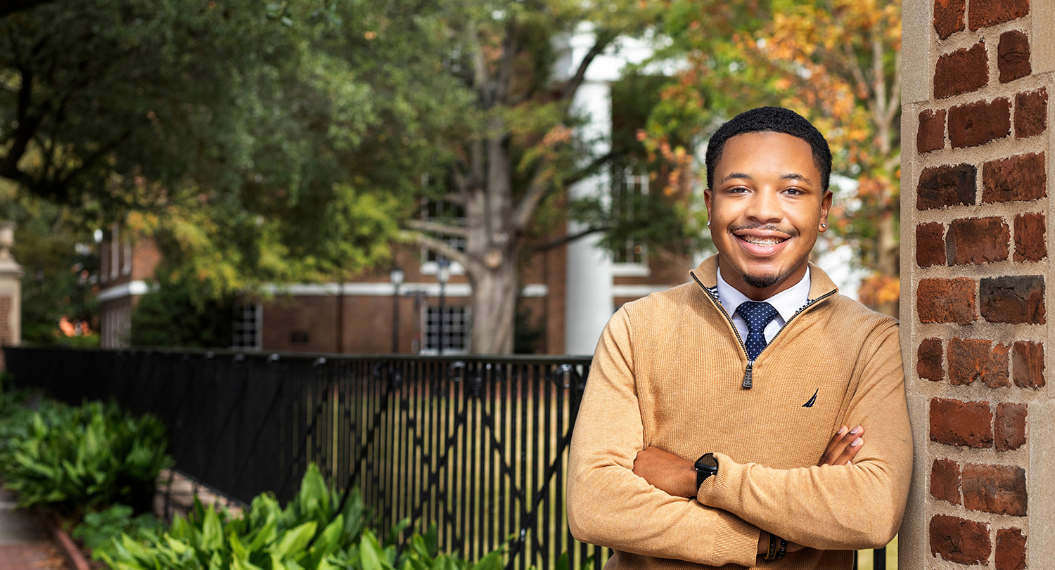 Keynan Kennedy leaning on a gate.