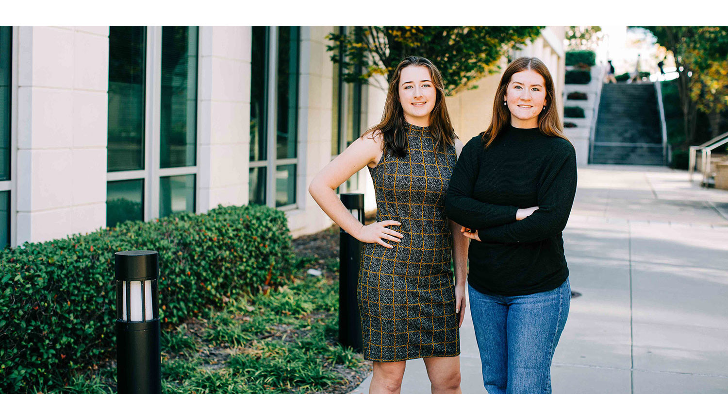 The McBride sisters stand outside.